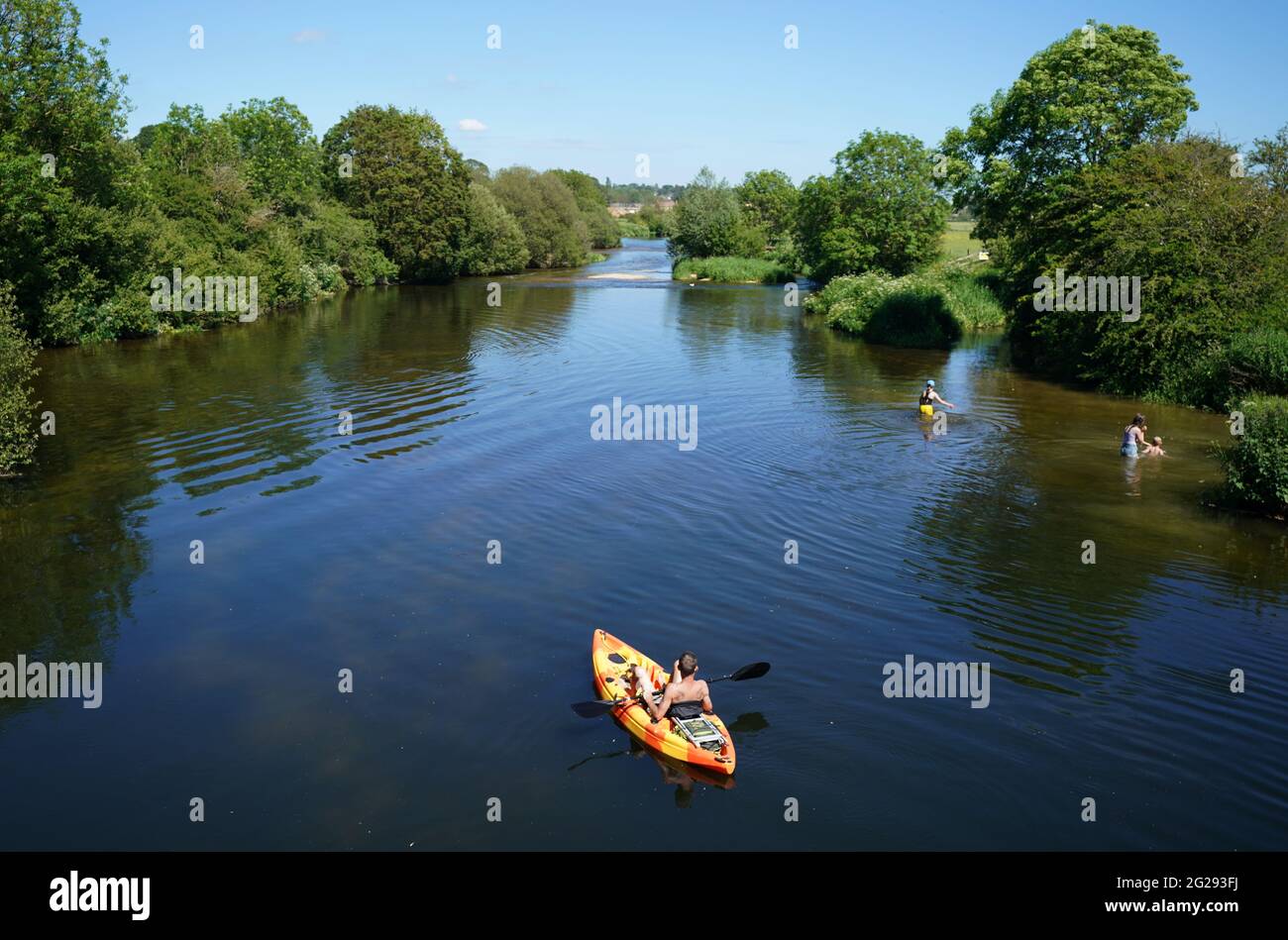 People kayak along the river Stour near to Wimborne in Dorset. Picture