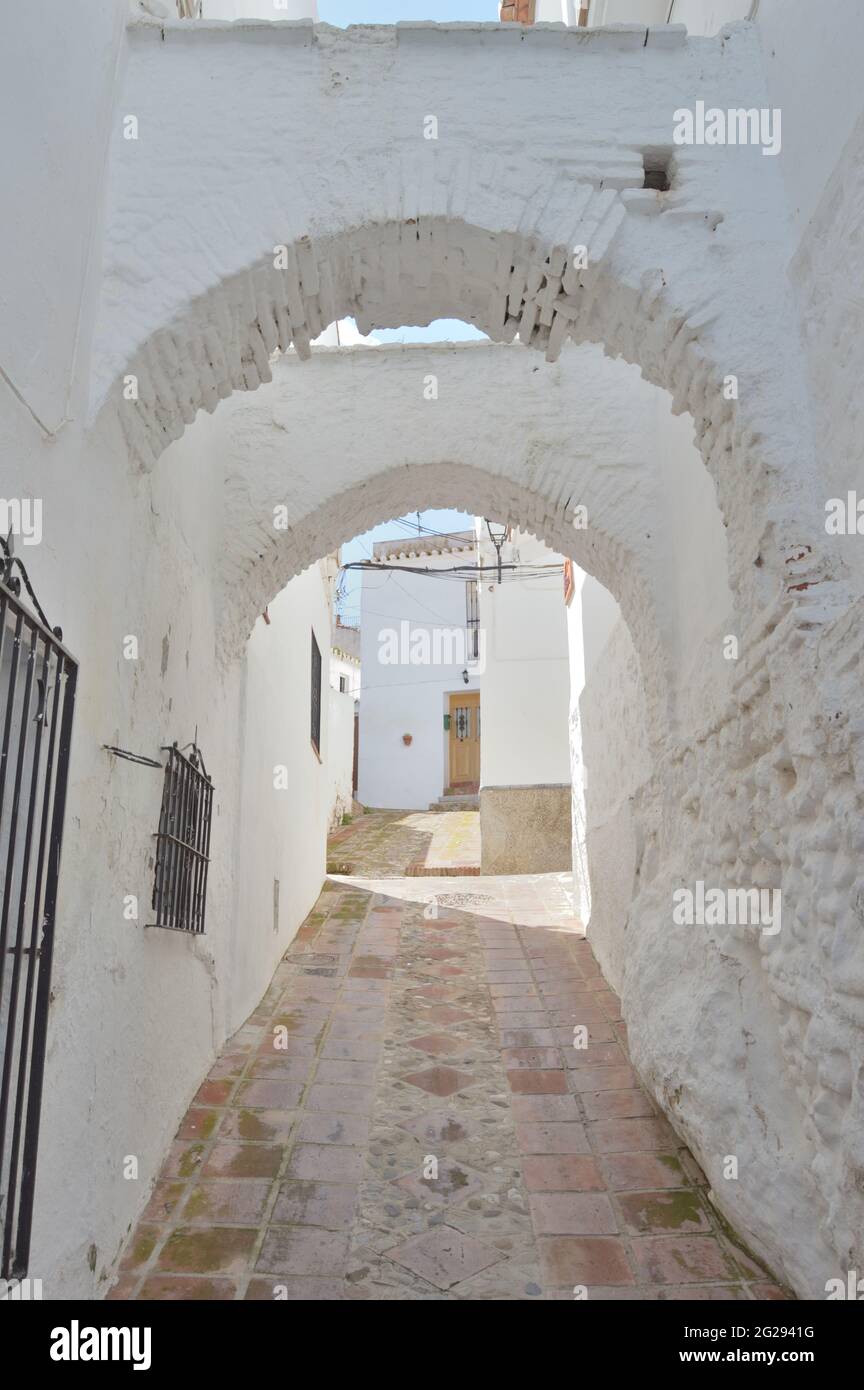 Ancient horseshoes arcs in a moorish street in Comares, Spain Stock