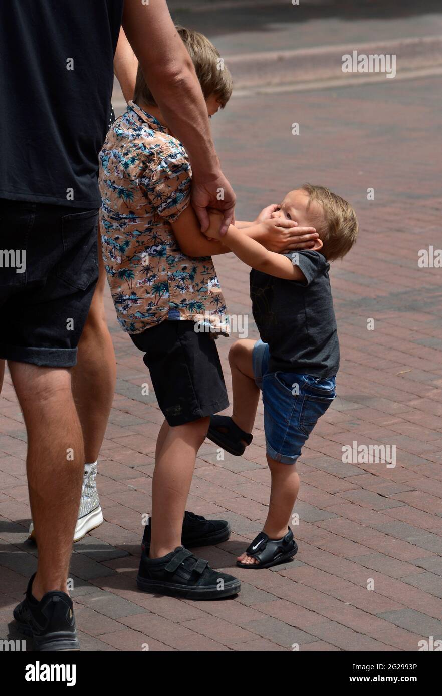 Two unruly boys visit Santa Fe, New Mexico, with their parents. Stock Photo