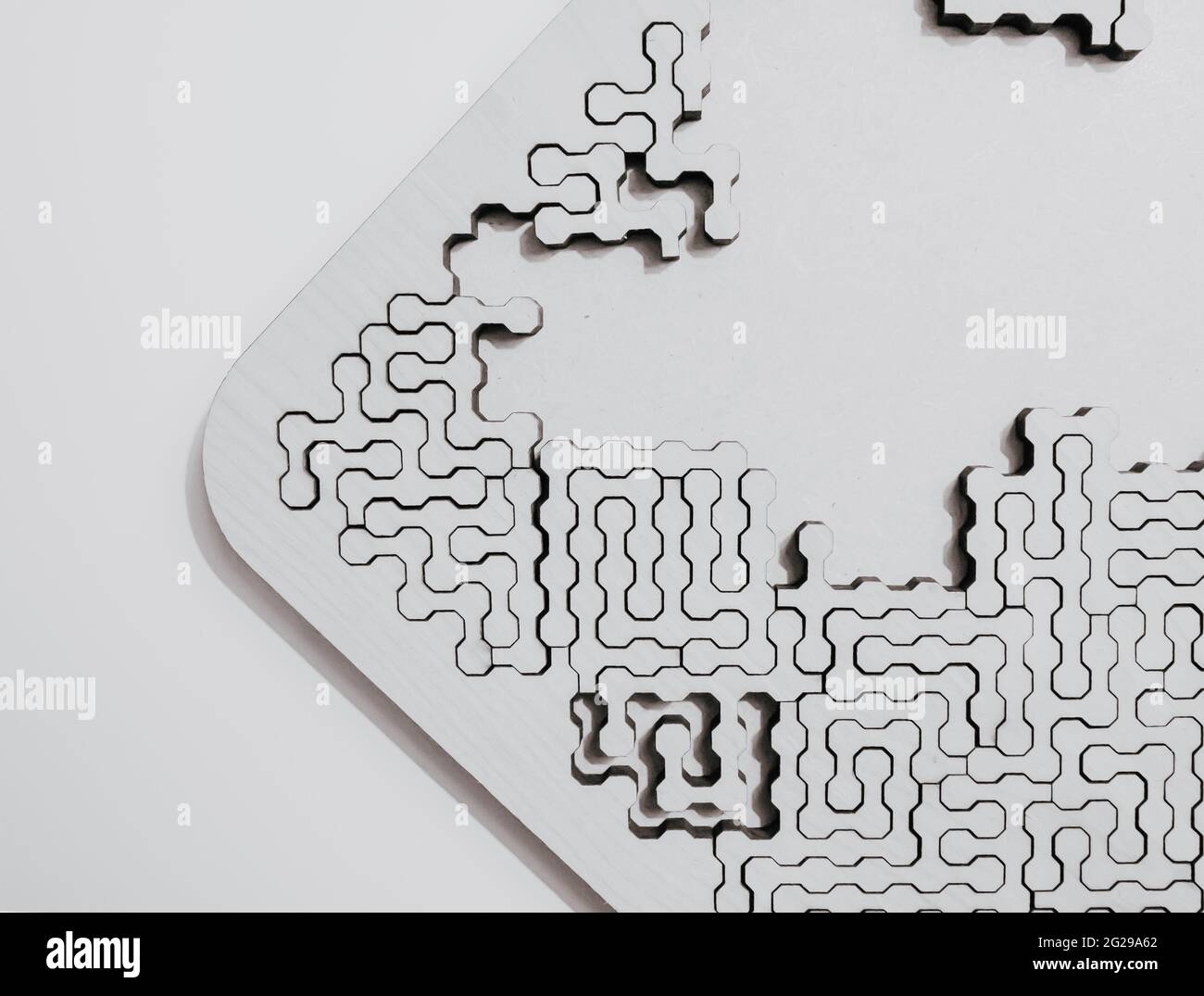 Overhead shot of a puzzle with frame and half pattern collected on an