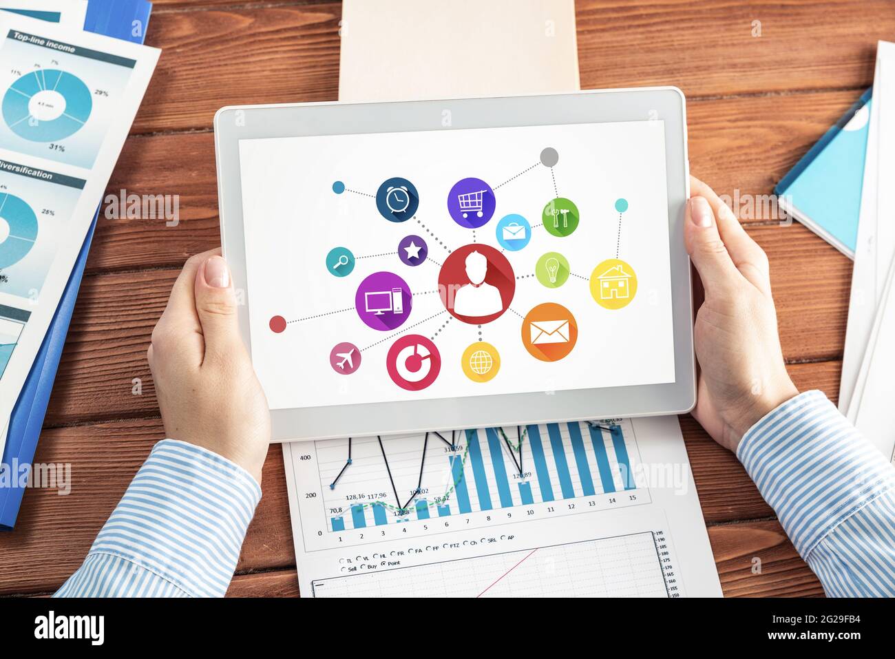 Businesswoman with a computer tablet at a work desk Stock Photo - Alamy