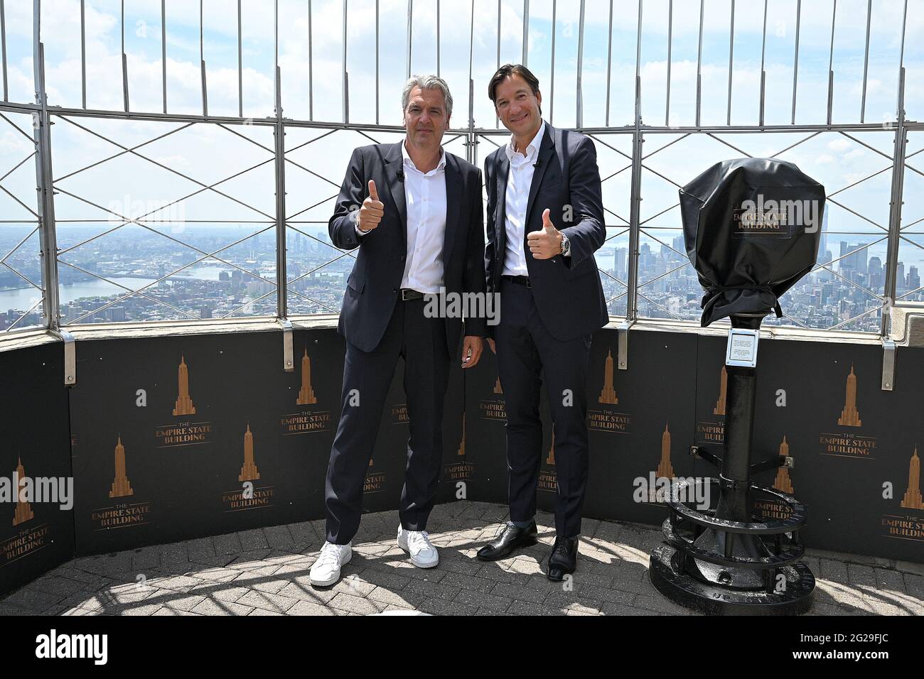 New York, USA. 09th June, 2021. (L-R) Joerg Wacker, FC Bayern Munich, Board Member for internationalization and strategy, and Rudolf Vidal, FC Bayern Munich, President - Americas, from FC Bayern Munich, German professional soccer sports club, visit the Empire State Building for a special lighting ceremony in New York, NY, June 9, 2021. (Photo by Anthony Behar/Sipa USA) Credit: Sipa USA/Alamy Live News Stock Photo