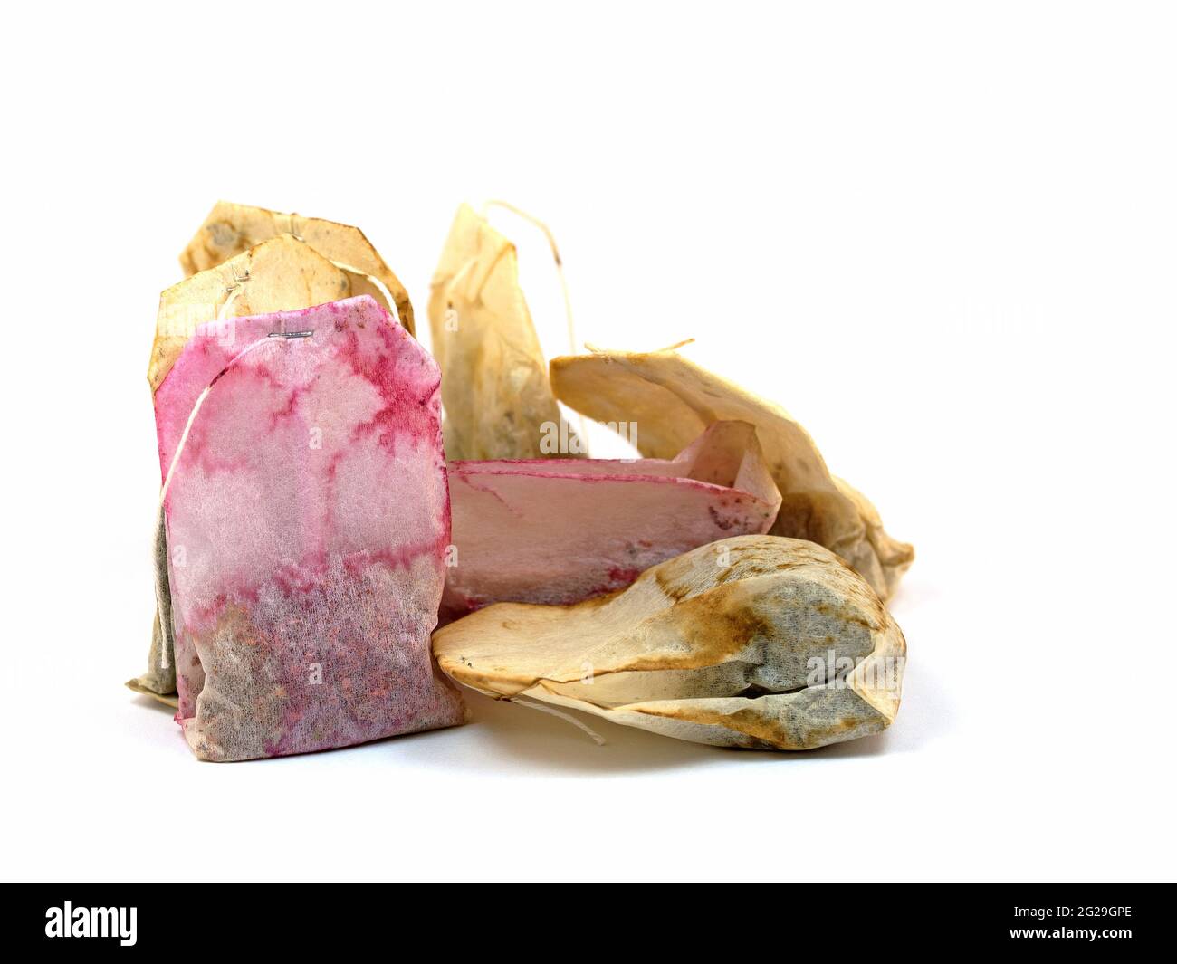 Used tea bags against white background Stock Photo