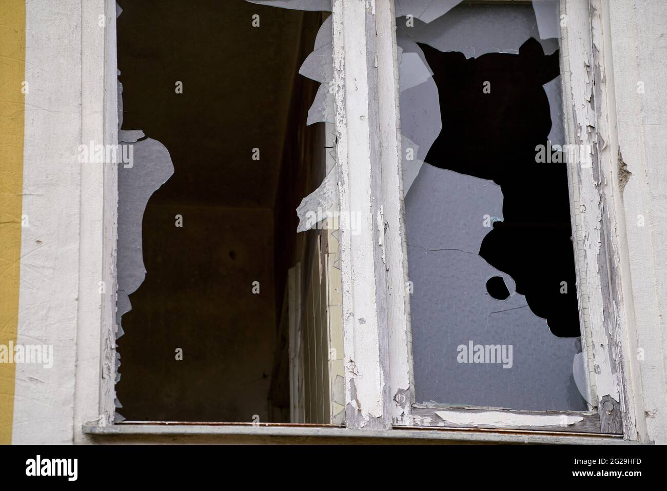 Old wooden frame and broken glass window on an old building for ...