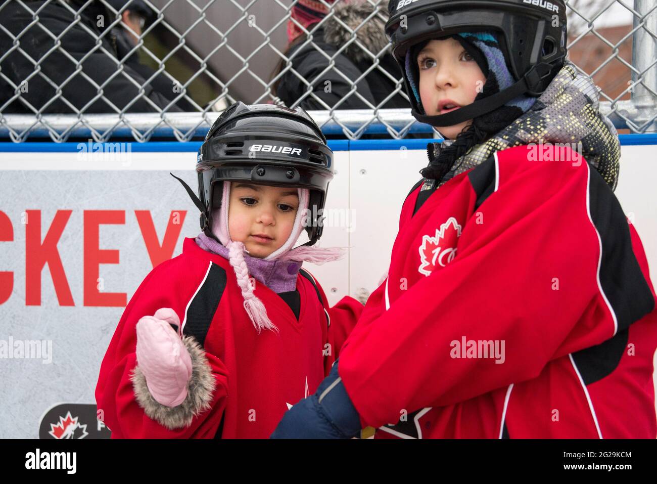 Community children enjoying the official opening of the Regent Park ice rink where there were Maple Leaf alumni and Police officers to teach them skat Stock Photo