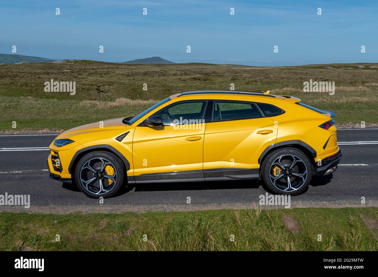 A Urus SUV photographed in the evening sunshine at