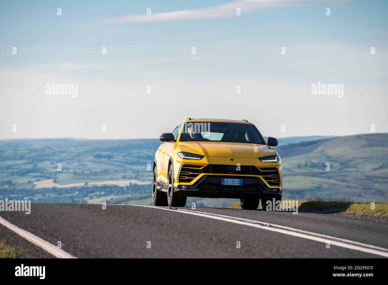 A Urus SUV photographed in the evening sunshine at