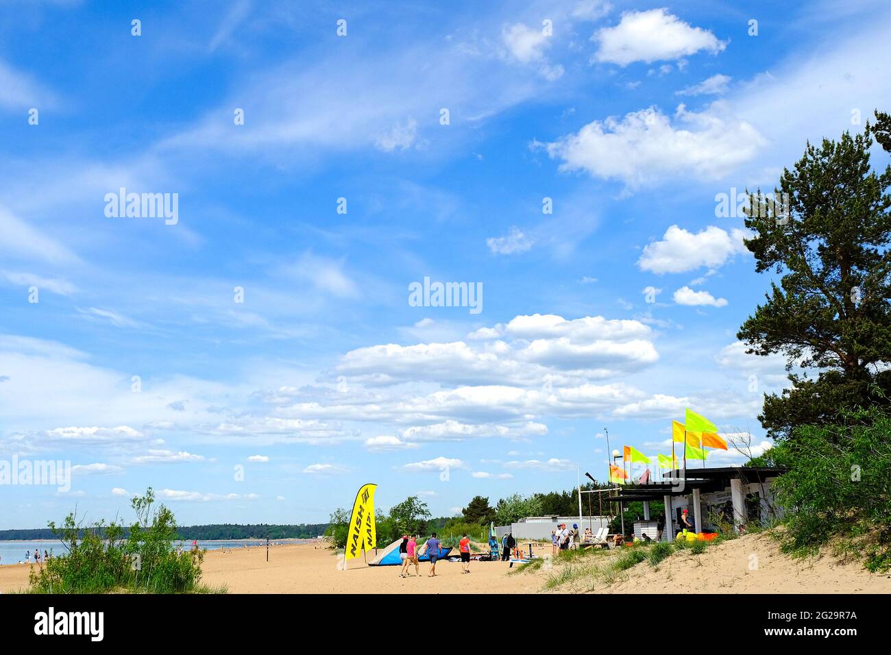 The beach of the surf school in retro style. The concept of a lifestyle of sports activity. The concept of a happy family. The concept of a summer bea Stock Photo