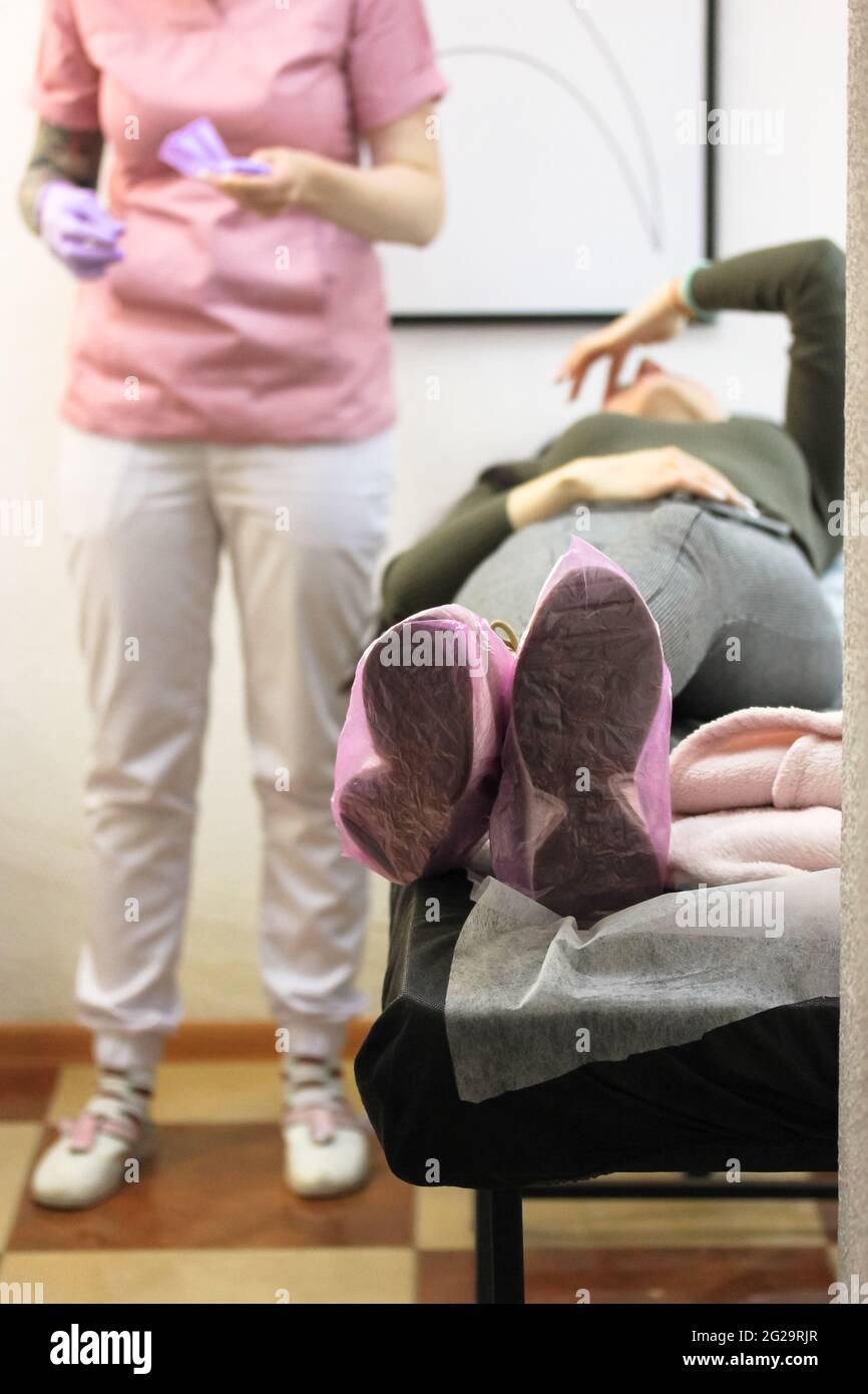 Doctor examination abdomen mature woman hires stock photography and