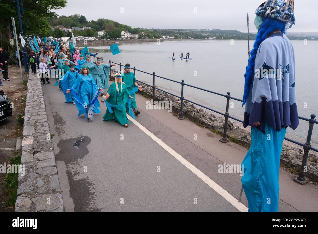 Mumbles, Swansea, UK. 9th June 2021:  Extinction Rebellion protest labelled 'Drowning in Promises' at the seaside town of Mumbles, near Swansea. Extinction Rebellion were highlighting the forthcoming G7 meeting which will be held at Carbis Bay, Cornwall on the weekend 11th to 13th June, 2021. Credit: Gareth Llewelyn/Alamy Stock Photo