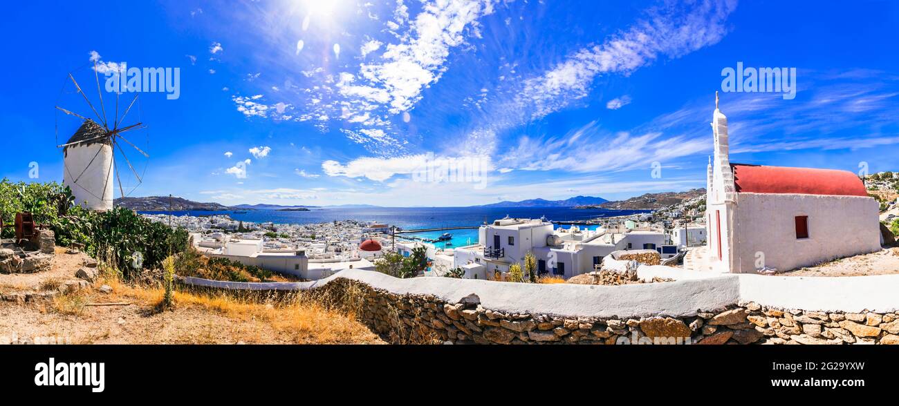 Traditional Greece. Cyclades, beautiful Mykonos island. Panoramic view of old town with windmill . Greek summer holidays Stock Photo