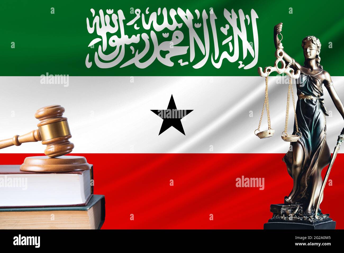 Law and justice in Somaliland. Statue of themis and the gavel of the judge against the background of the flag of Somaliland. Law and justice concept. Stock Photo