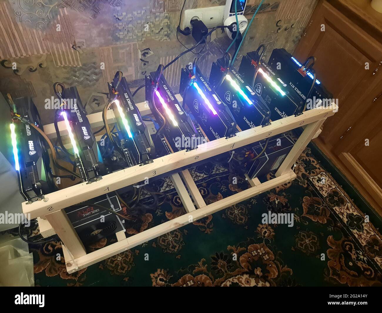 Setting up a cryptocurrency mining rig with optimal operating parameters. Stock Photo