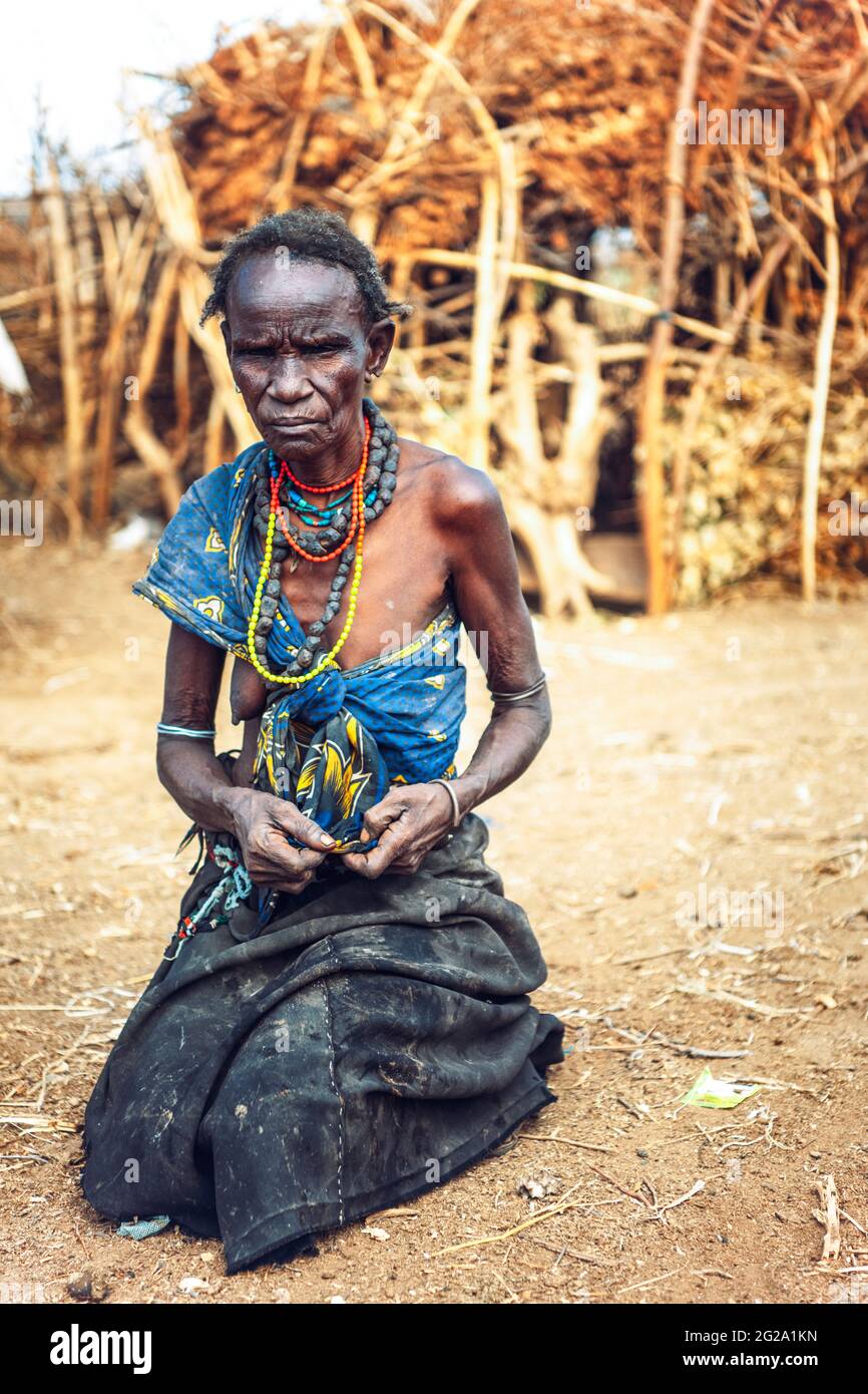 Serious senior Woman from Dassanech tribe in a village, Omo valley, Ethiopia Stock Photo