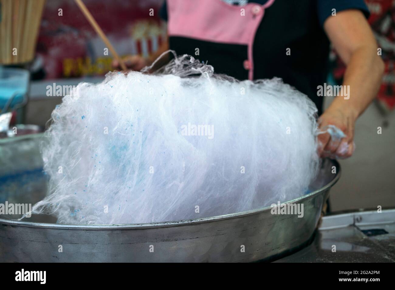 Unrecognizable person preparing the cotton candy machine Stock Photo