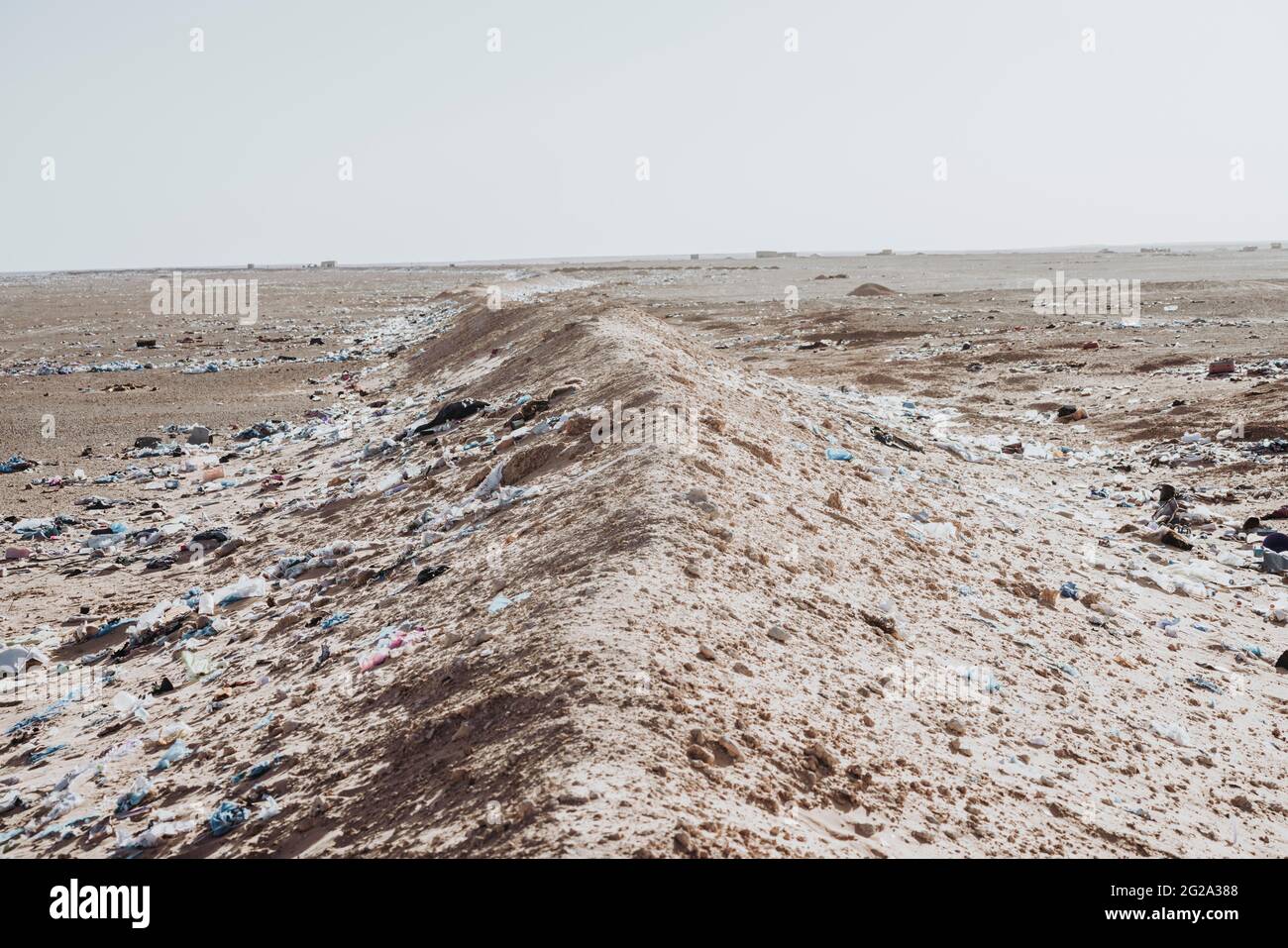 Landscape with garbage in the middle of the Sahara desert Stock Photo