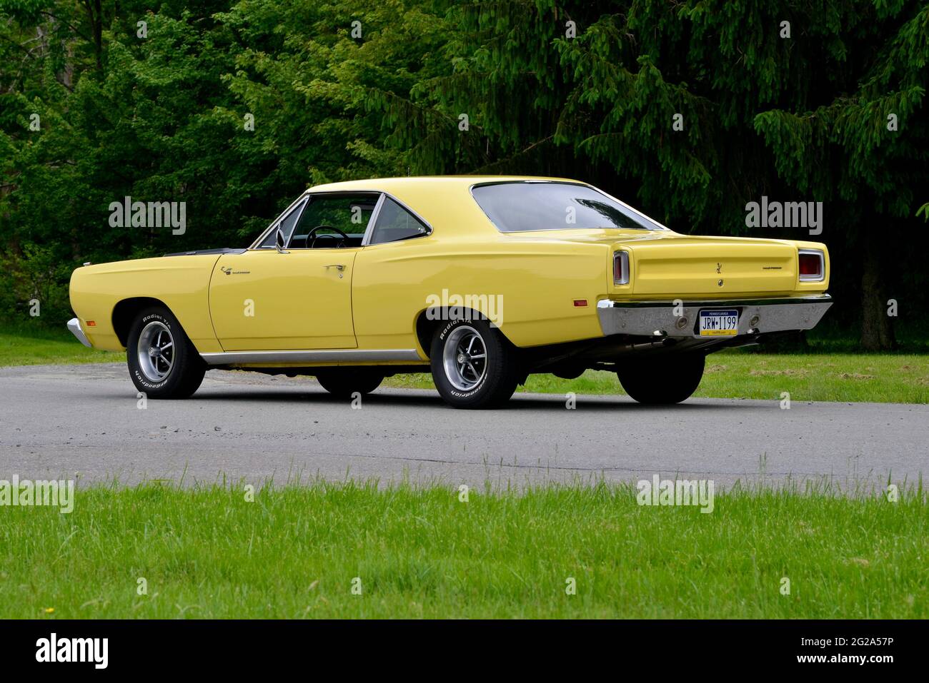 Sunfire Yellow 1969 Plymouth Road Runner Sport Coupe rear three-quarter view Stock Photo