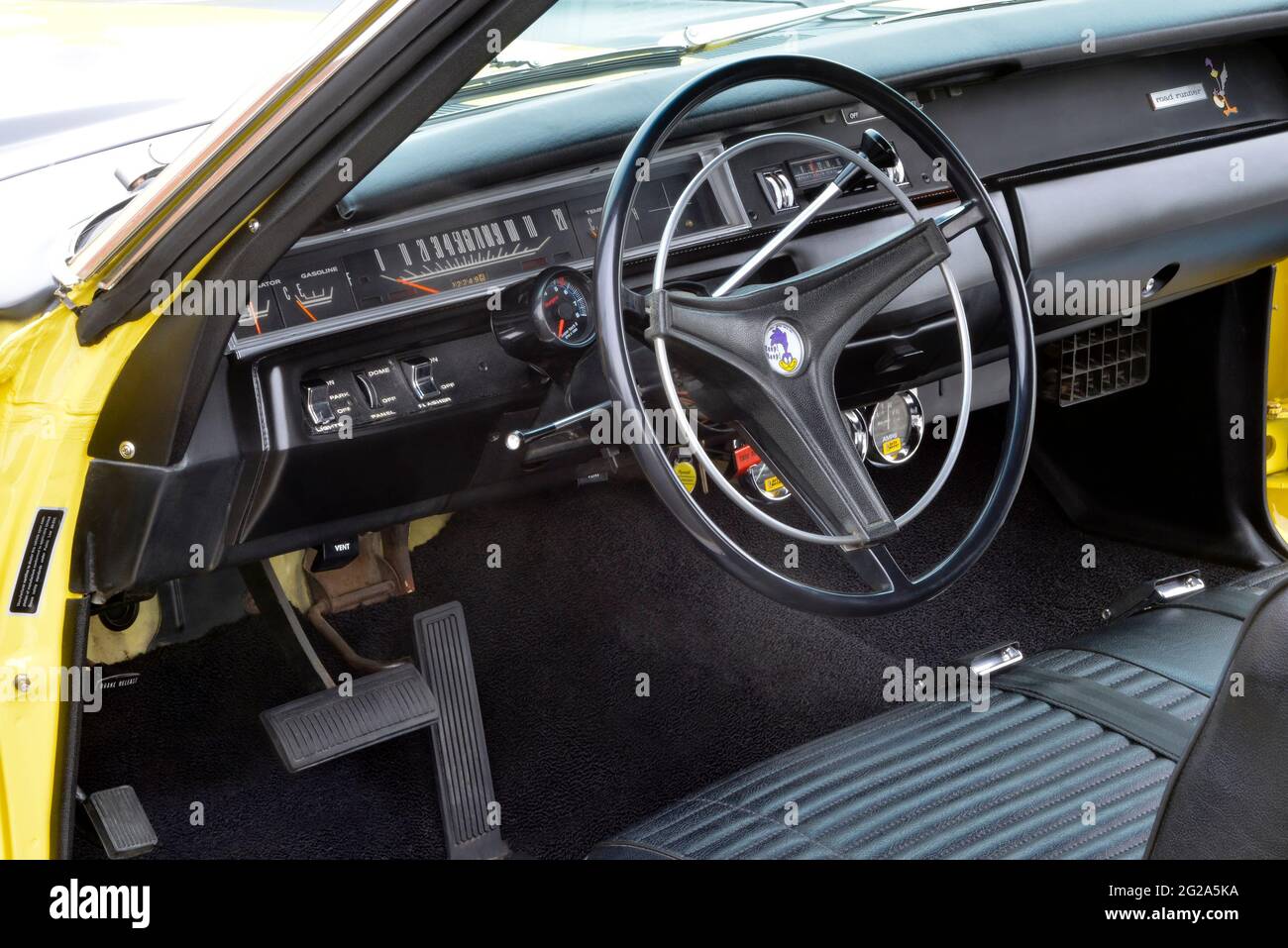 Sunfire Yellow 1969 Plymouth Road Runner Sport Coupe black dashboard Stock Photo