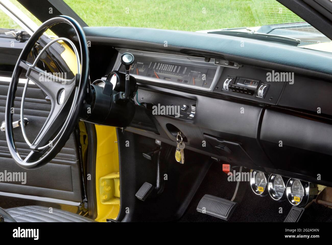 Sunfire Yellow 1969 Plymouth Road Runner Sport Coupe black dashboard Stock Photo