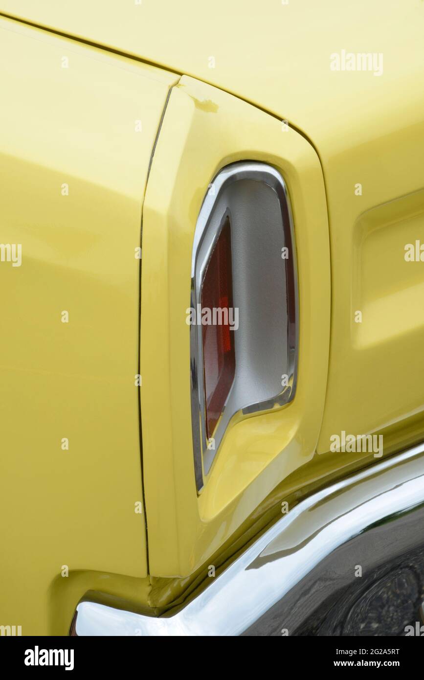 Sunfire Yellow 1969 Plymouth Road Runner Sport Coupe left taillight detail Stock Photo