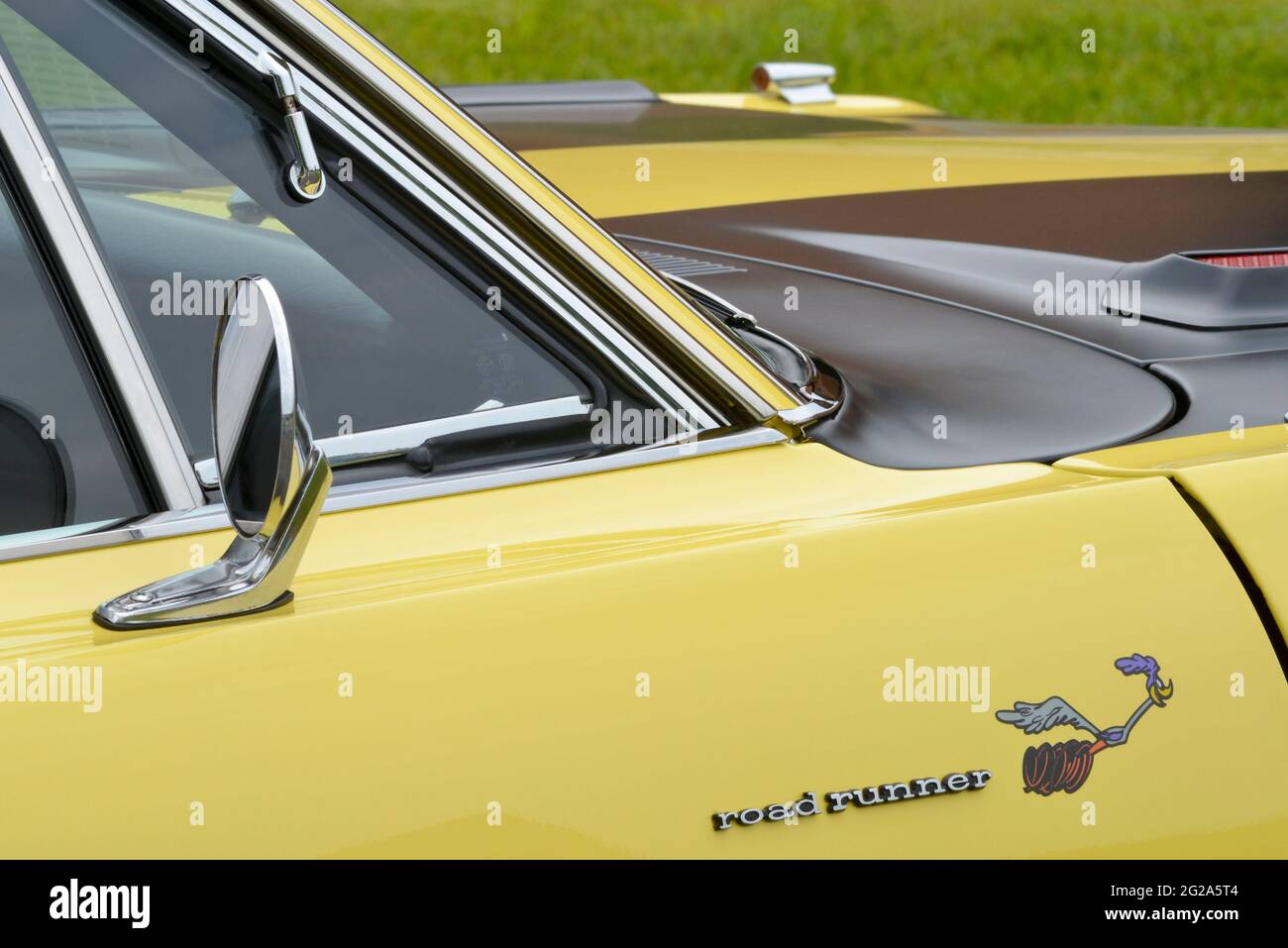 Sunfire Yellow 1969 Plymouth Road Runner Sport Coupe door details Stock Photo