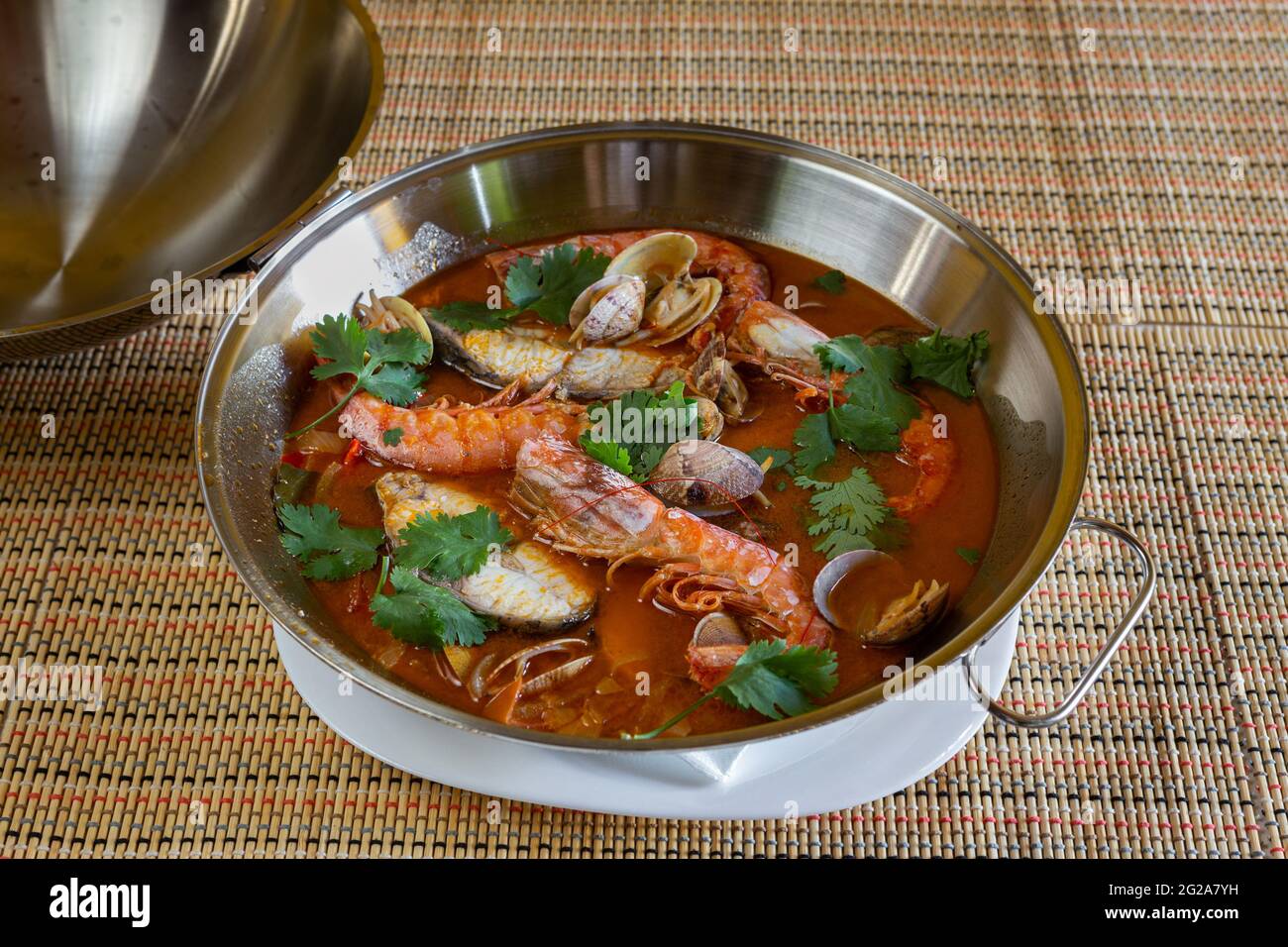 Traditional portuguese seafood dish cataplana. The main ingredients are