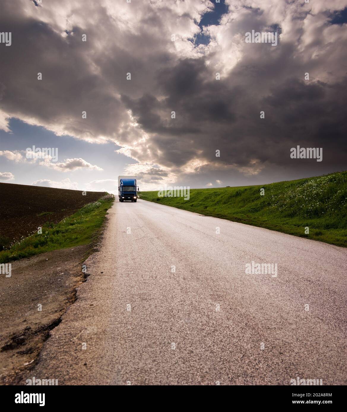 landscape for truck on road and stormy sky Stock Photo - Alamy