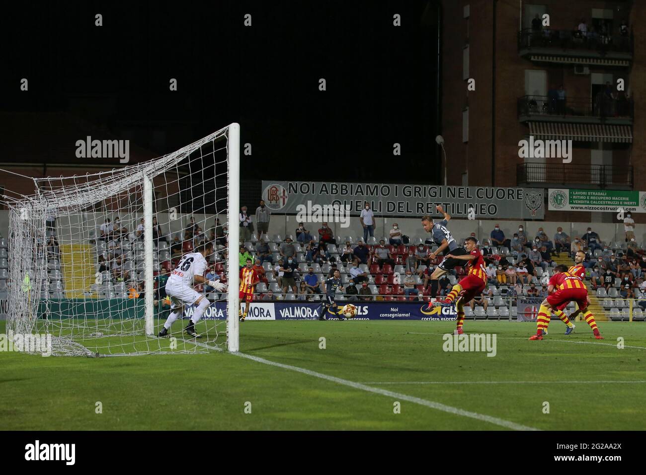 Torino, Italy, 9th June 2021. Francesco Stanco of US Alessandria heads the ball past Alberto Savini of UC Albinoleffe to level the game at 2-2 on the night and give the side a 4-3 aggregate lead during the Serie C match at Stadio Giuseppe Moccagatta - Alessandria, Torino. Picture credit should read: Jonathan Moscrop / Sportimage Stock Photo