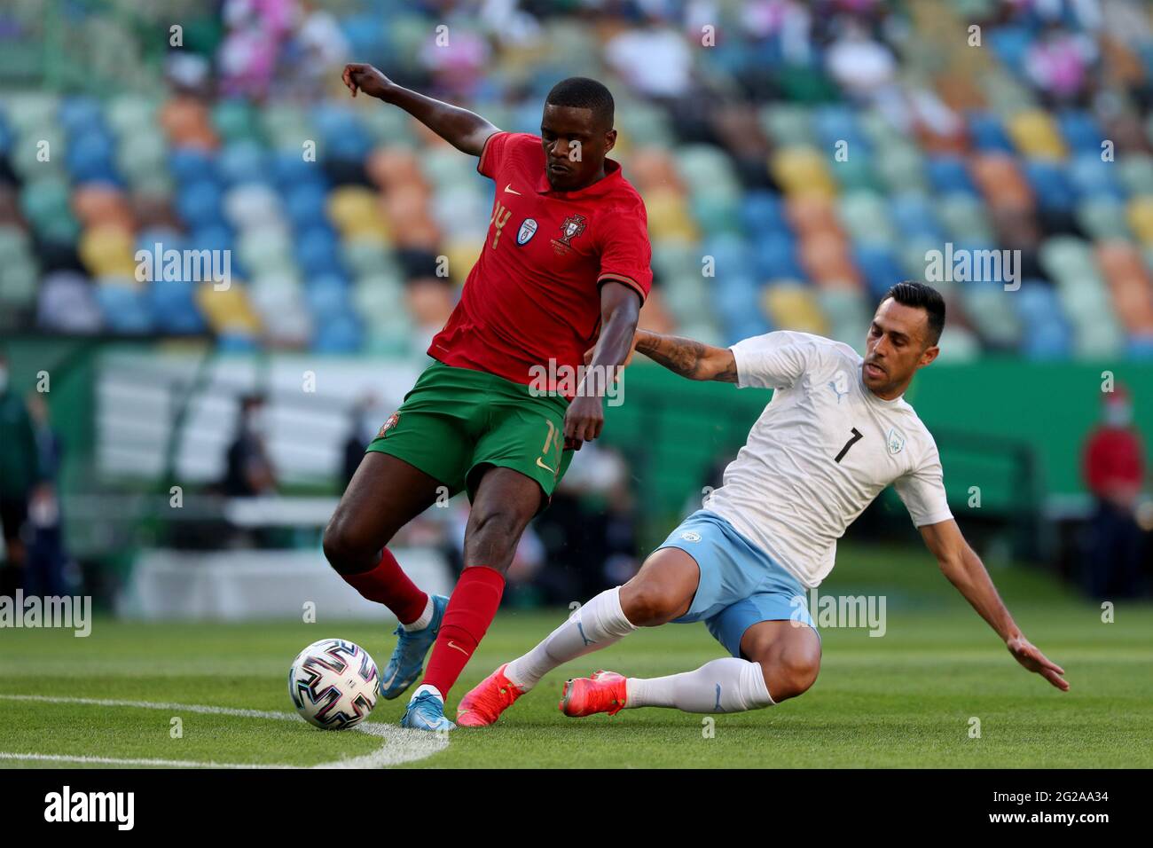 Lisbon, Portugal. 9th June, 2021. William Carvalho of Portugal (L) vies with Eran Zahavi of Israel during the international friendly football match between Portugal and Israel, at the Jose Alvalade stadium in Lisbon, Portugal, on June 9, 2021, ahead of the UEFA EURO 2020 European Championship. Credit: Pedro Fiuza/ZUMA Wire/Alamy Live News Stock Photo