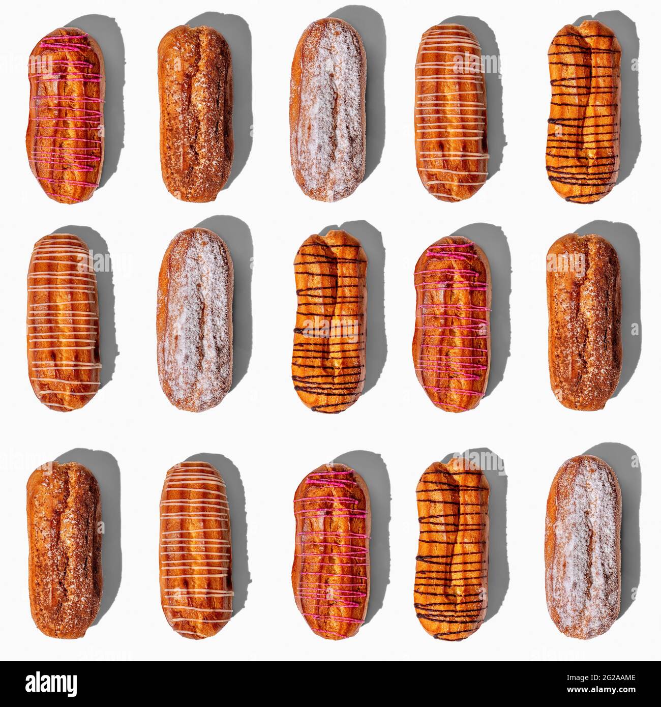 Set of fresh eclairs with original decor on a white background. pattern ...