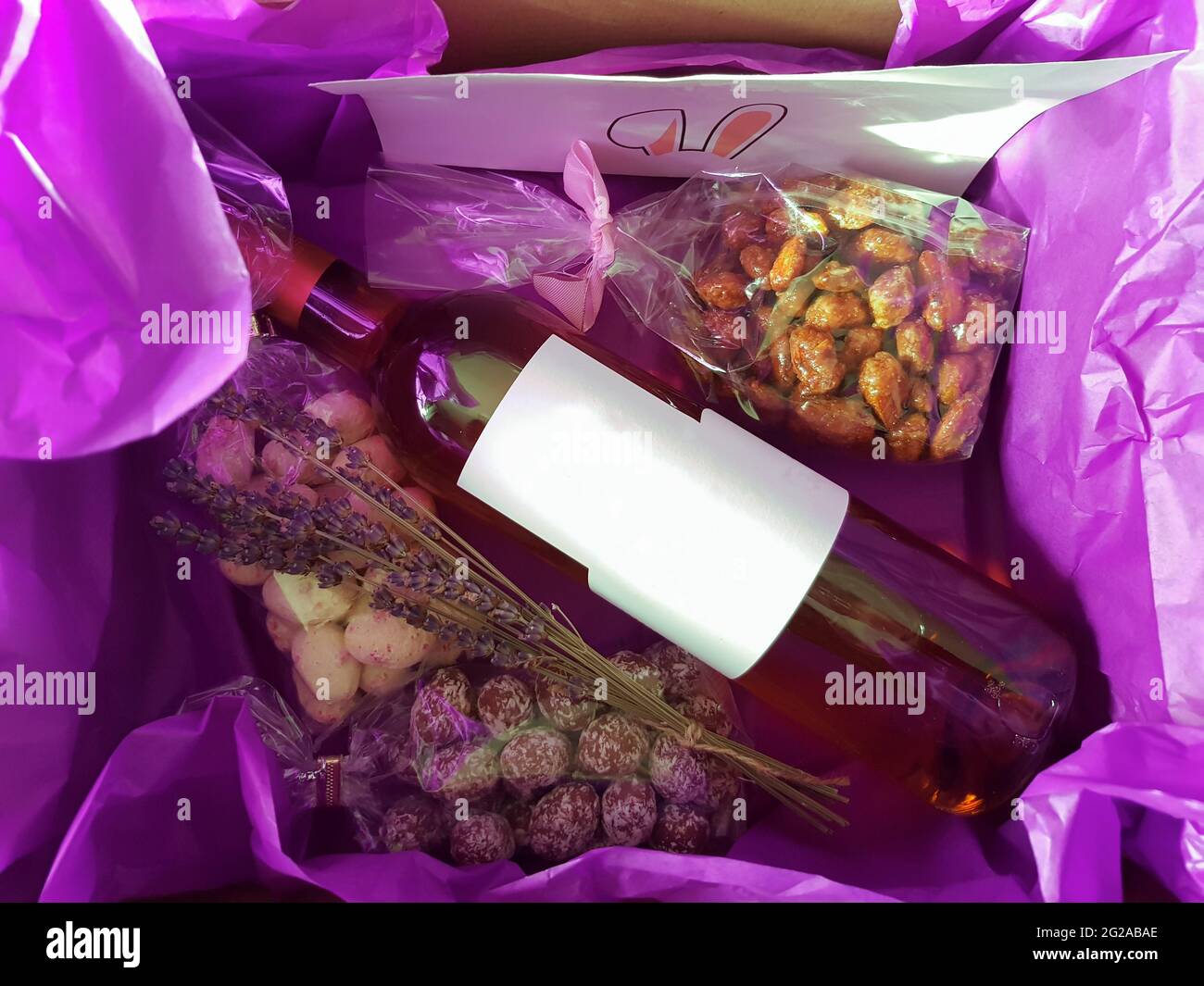 Top view of Gift box with easter sweets and muscatel bottle Stock Photo