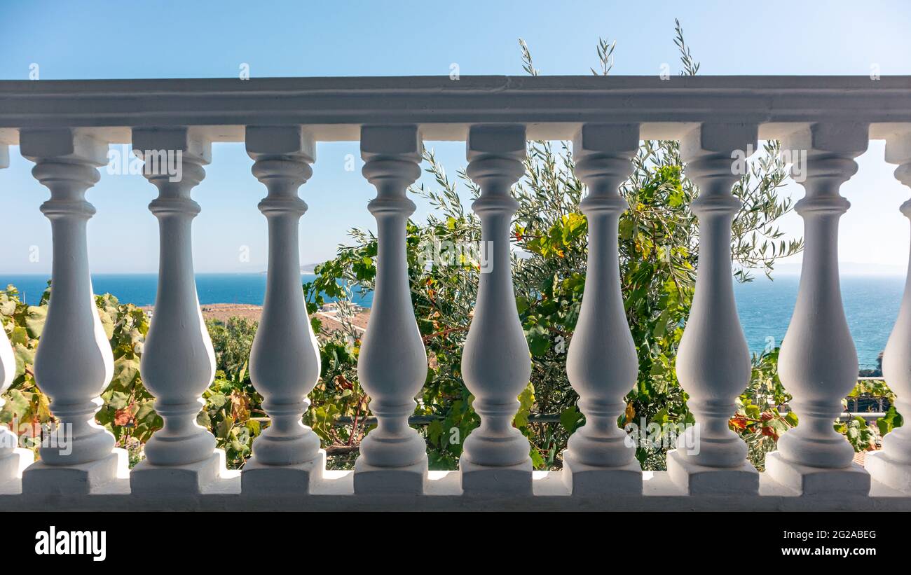 Traditional Greek architecture white balcony balusters. View on clear blue  Aegean sea coast. Summer scenic view from country house terrace near Athens  Stock Photo - Alamy