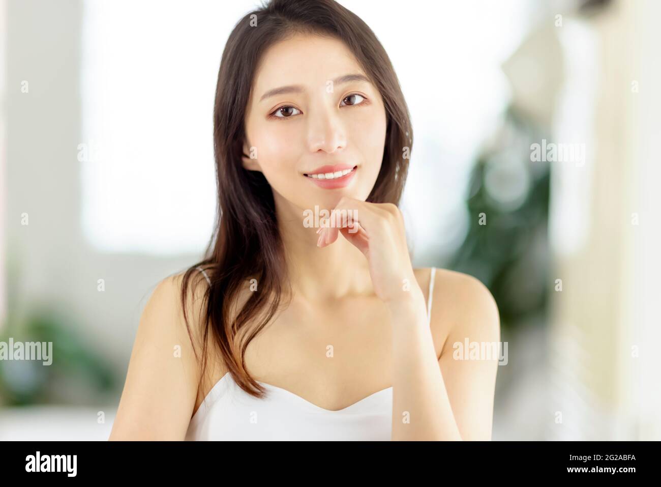 Beautiful pretty asian woman with clean fresh healthy skin Stock Photo