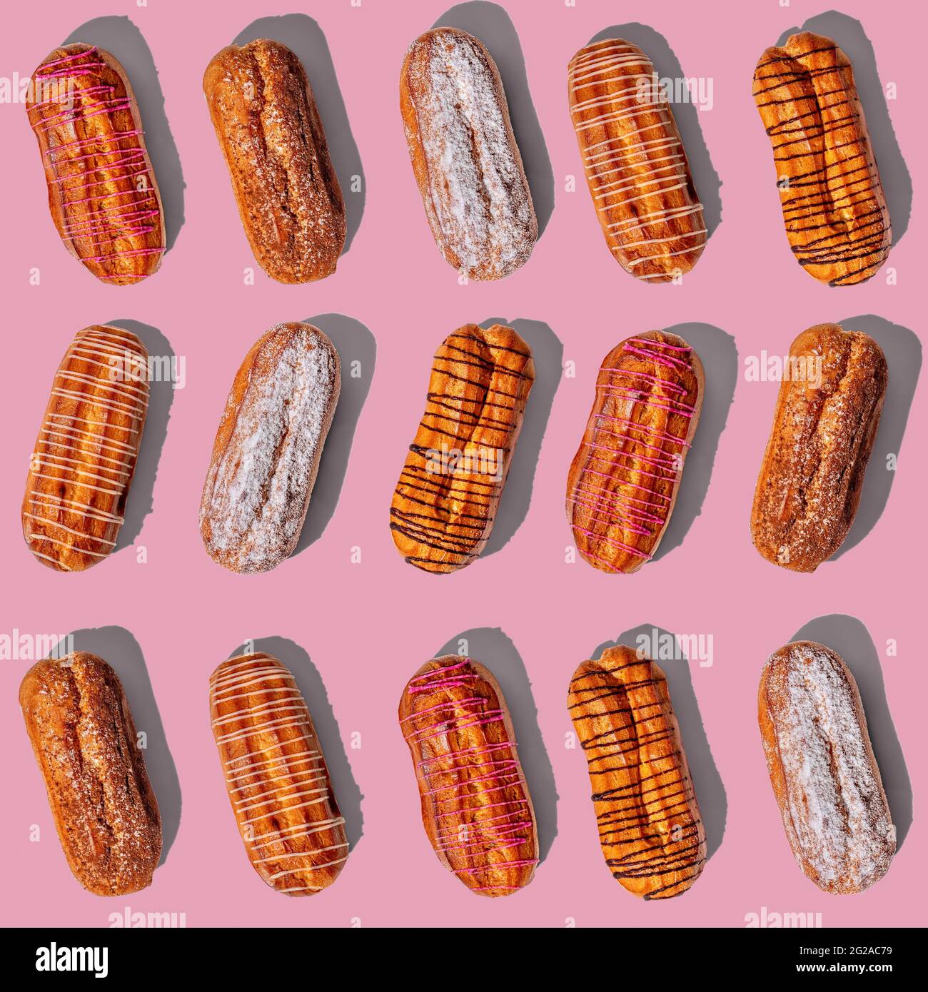 Set of fresh eclairs with original decor on a pink background. pattern ...
