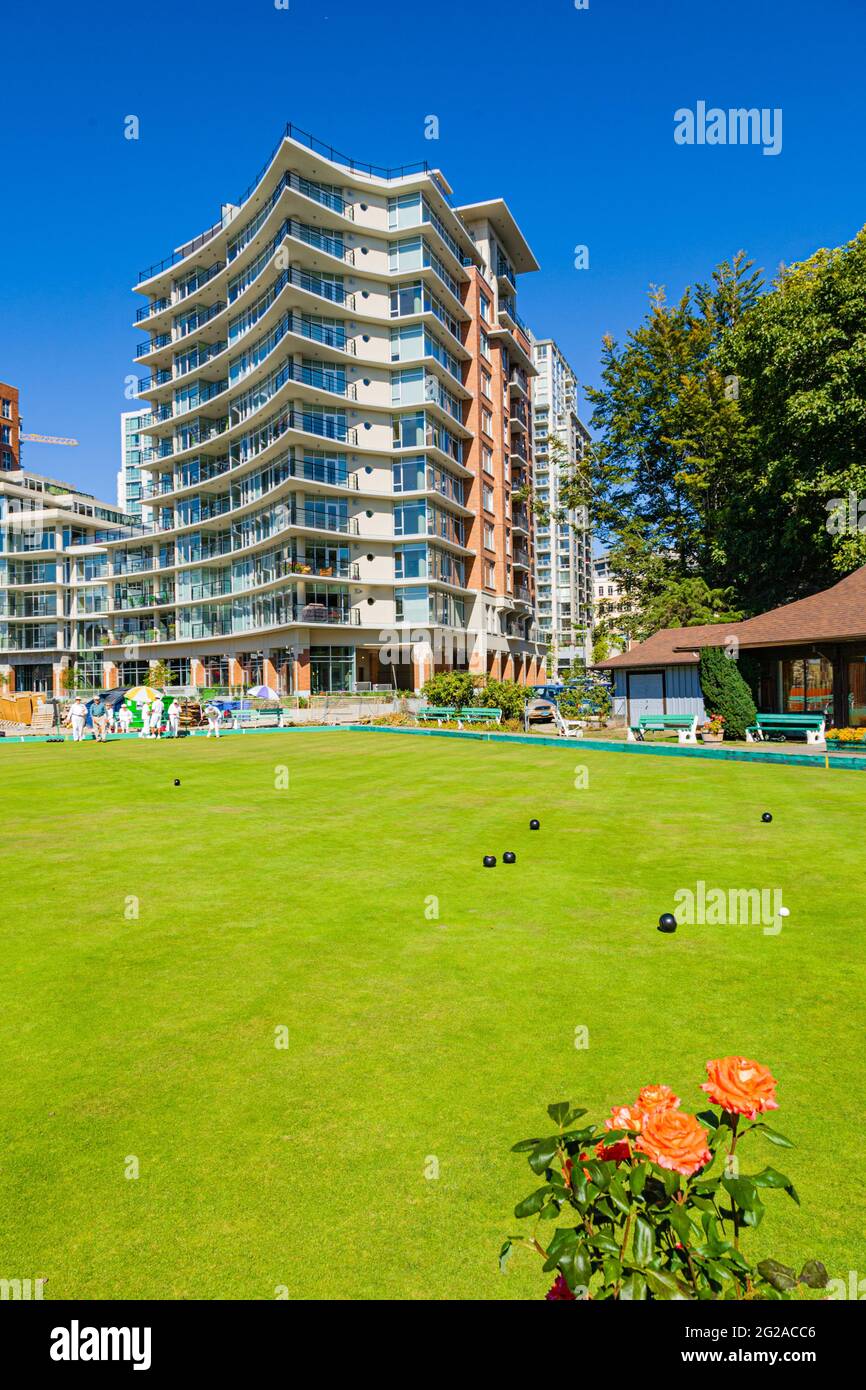 Victoria bowling green overshadowed by a modern apartment building near downtown in British Columbia Canada Stock Photo