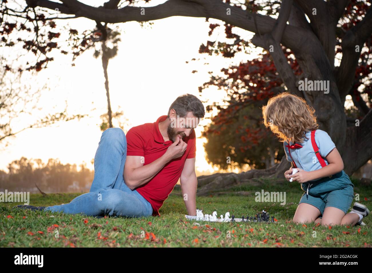 parenthood and childhood. checkmate. time together. strategic and tactic. tutorship. Stock Photo