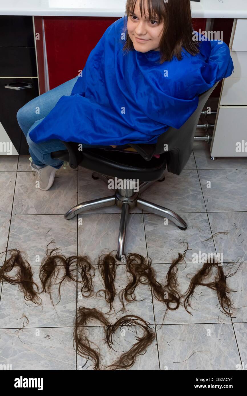 Portrait of cute young girl with new hairstyle and name on the floor written of cut hair Stock Photo - Alamy Portrait of cute young girl with new hairstyle and name on the floor written of cut hair Stock Photo - Alamy