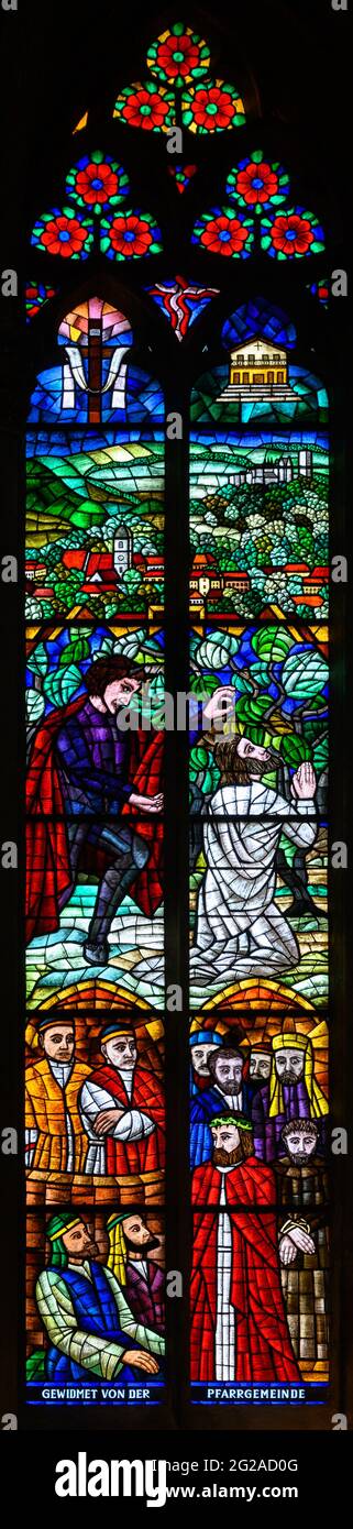Stained-glass window depicting Jesus on the Mount of Olives and condemnation by Pontius Pilate. Votivkirche – Votive Church, Vienna, Austria. Stock Photo