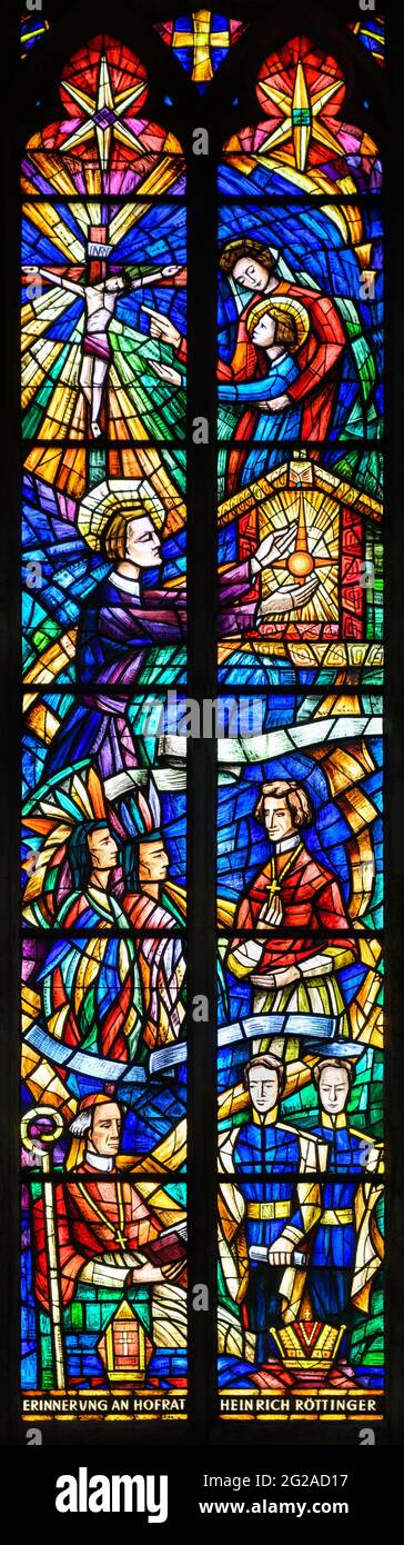 Stained-glass window depicting the life of Saint Clement Mary Hofbauer and his disciples Frederic Baraga and Cardinal Rauscher. Votivkirche. Stock Photo