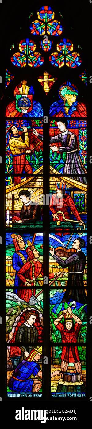 Stained-glass window depicting the evangelization of South America. Votivkirche – Votive Church, Vienna. Stock Photo