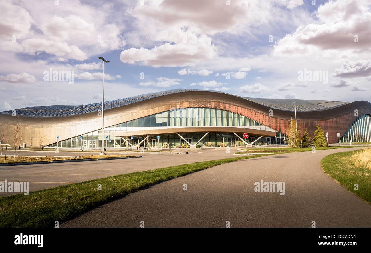 Calgary Alberta Canada, May 12 2021: A concrete bike path at the Rocky Ridge YMCA sport facility under a cloudy sky. Stock Photo