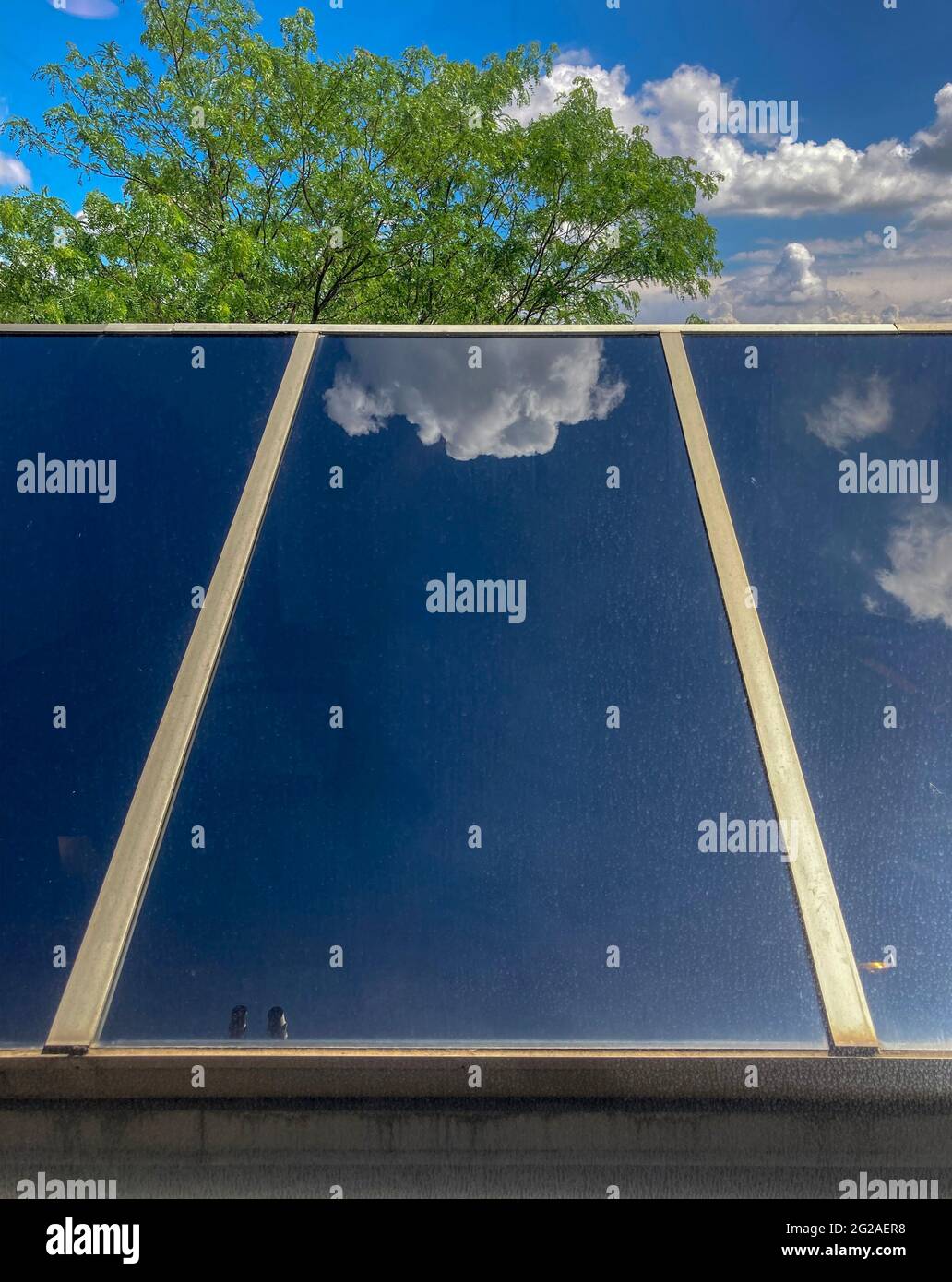 reflection of clouds on a solar panel Stock Photo