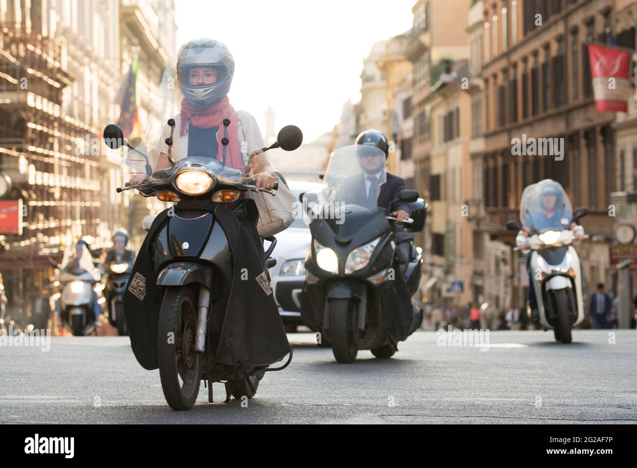 Commuters on mopeds in Rome Stock Photo