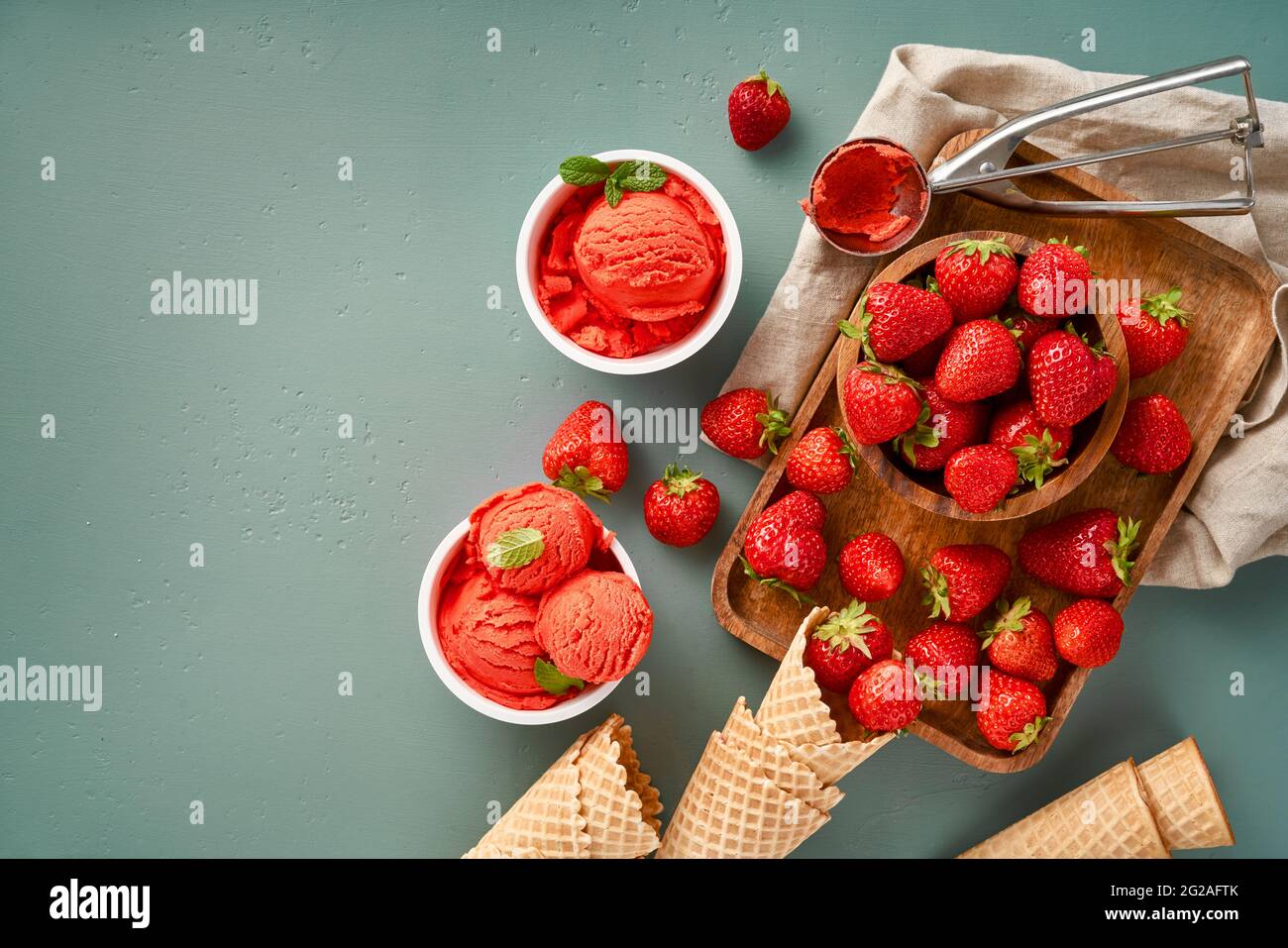 Pastel pink ice cream scoops in rows on blue background - Free