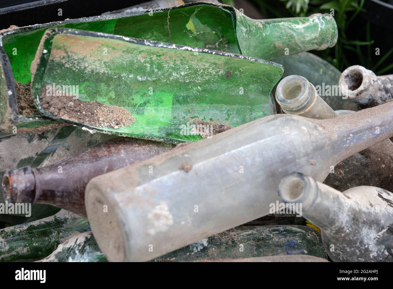 Empty glass bottles in a pile. Waste collection and sorting. Ecology