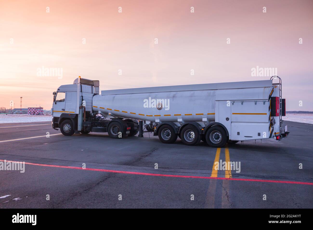 White tank truck aircraft refueler at the airport apron Stock Photo - Alamy
