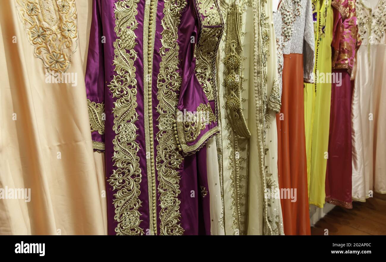 Moroccan dresses and fabrics in clothing store, fashion objects, Arabic