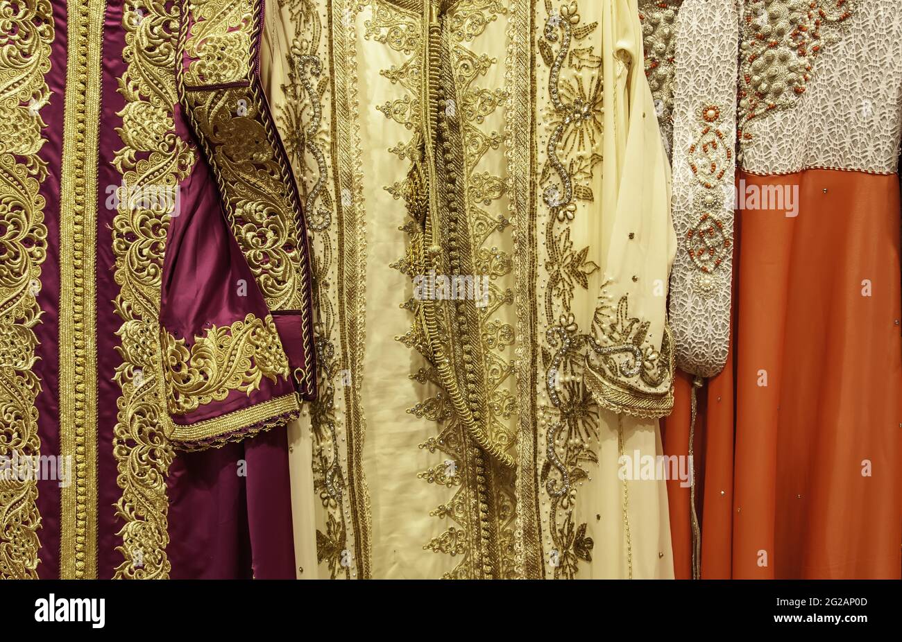 Moroccan dresses and fabrics in clothing store, fashion objects, Arabic
