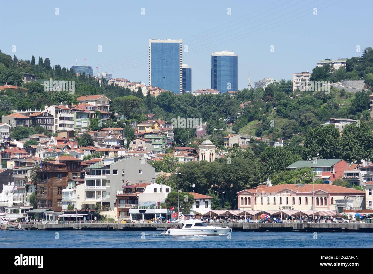 the Arnavutkoy village on the Bosporus waterfront is a historic neighborhood in Istanbul on the background the skyscrapers of modern Levent neighborho Stock Photo