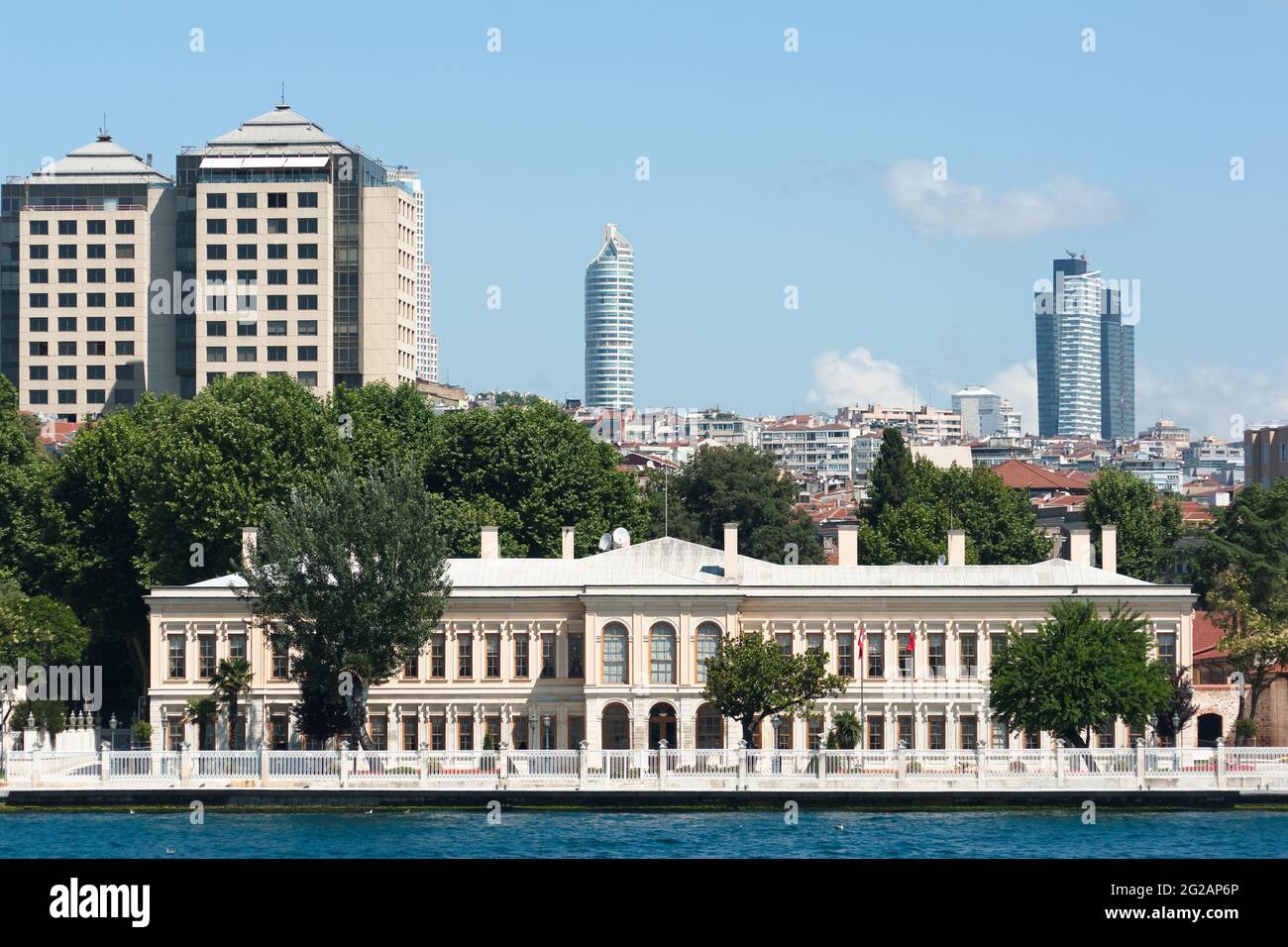 old palace on the Bosporus waterfront on the background the skyscrapers